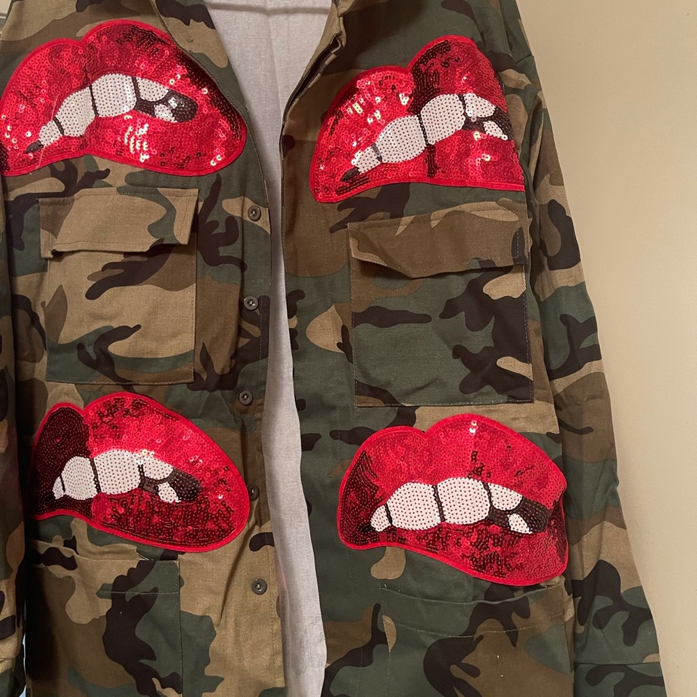 Army jacket with red patch lips on the jacket